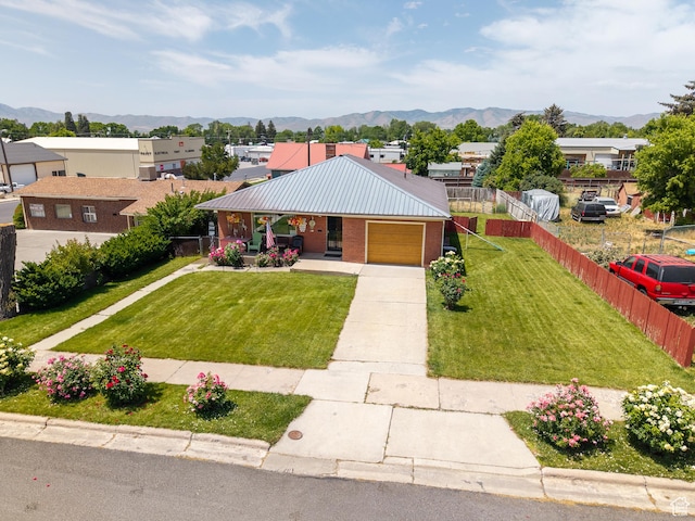 115 N Main St, Malad City, ID 83252 - single story home featuring a mountain view, driveway, brick siding, and a porch