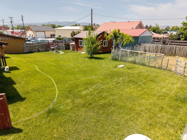 115 N Main St, Malad City, ID 83252 - fenced yard with a garden and an outbuilding