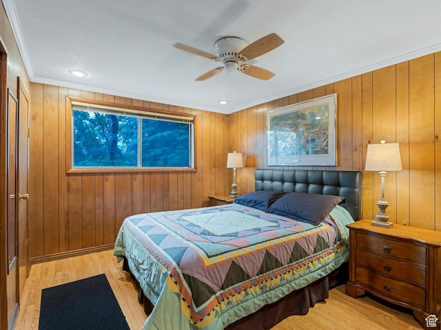 3645 E Fortuna Cir, Salt Lake City, UT 84124 - bedroom featuring light wood finished floors, crown molding, wooden walls, and a ceiling fan