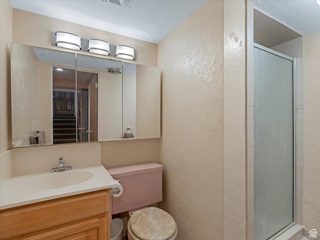 3645 E Fortuna Cir, Salt Lake City, UT 84124 - full bathroom with a textured wall, a stall shower, a textured ceiling, and vanity