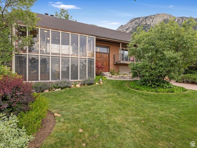 3645 E Fortuna Cir, Salt Lake City, UT 84124 - rear view of property featuring a lawn, a mountain view, and brick siding