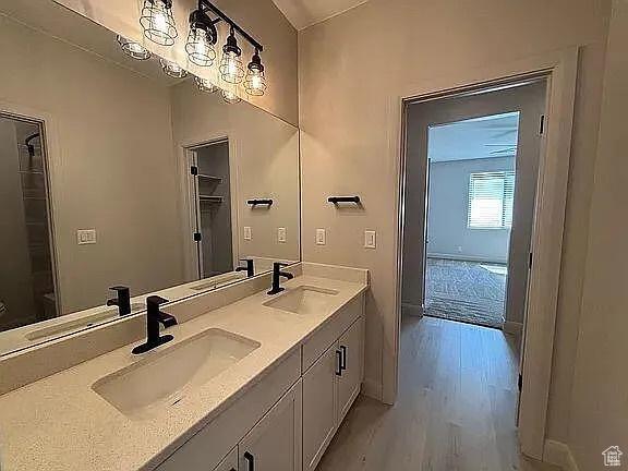 840 N Twin Lakes Dr Unit 414, St George, UT 84790 - full bathroom with double vanity and wood finished floors
