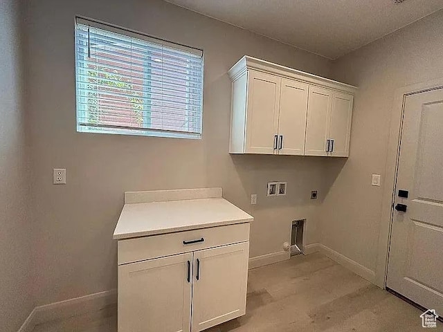840 N Twin Lakes Dr Unit 414, St George, UT 84790 - laundry room featuring cabinet space, electric dryer hookup, hookup for a washing machine, and light wood-style flooring
