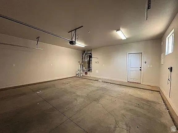 840 N Twin Lakes Dr Unit 414, St George, UT 84790 - garage featuring baseboards and a garage door opener