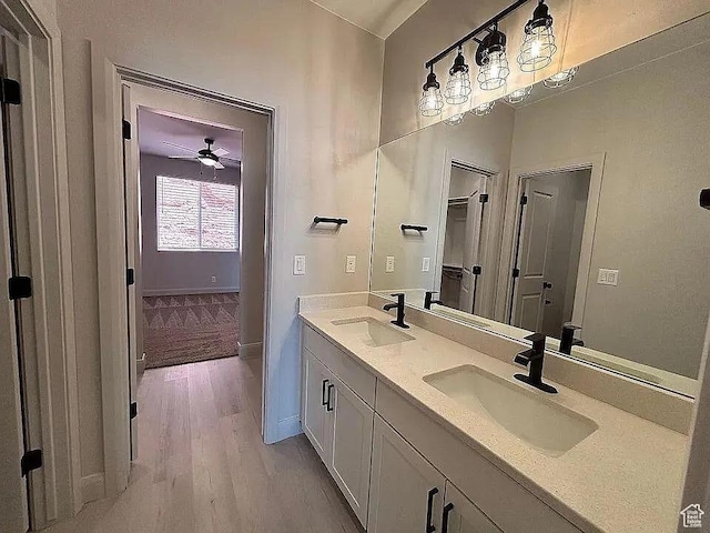 840 N Twin Lakes Dr Unit 414, St George, UT 84790 - bathroom with wood finished floors, double vanity, and a ceiling fan