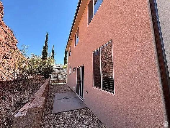 840 N Twin Lakes Dr Unit 414, St George, UT 84790 - view of home's exterior with stucco siding and a patio