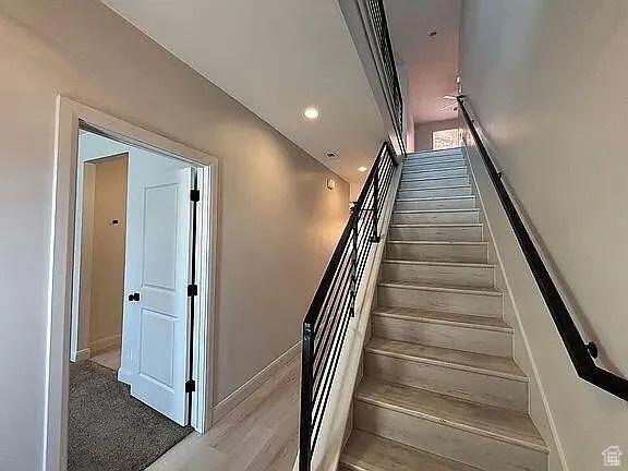 840 N Twin Lakes Dr Unit 414, St George, UT 84790 - staircase featuring wood finished floors and baseboards