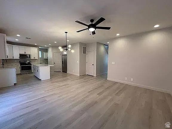 840 N Twin Lakes Dr Unit 414, St George, UT 84790 - kitchen with appliances with stainless steel finishes, recessed lighting, open floor plan, a ceiling fan, and light wood finished floors