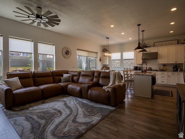 4821 W Juniper Bend Cir Unit 101, Herriman, UT 84096 - living room with recessed lighting, dark wood finished floors, a ceiling fan, and a textured ceiling