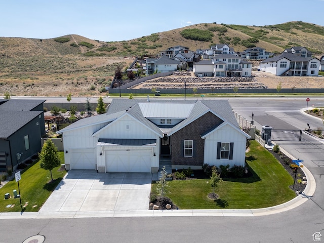 4821 W Juniper Bend Cir Unit 101, Herriman, UT 84096 - aerial perspective of suburban area featuring a mountain backdrop