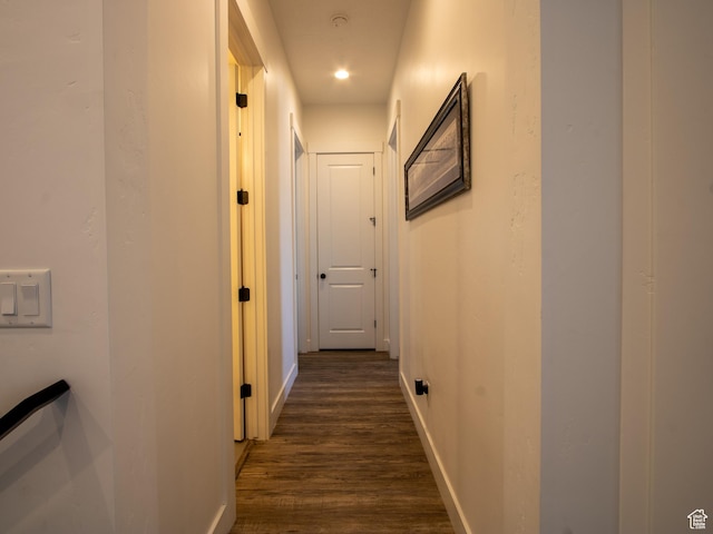 4821 W Juniper Bend Cir Unit 101, Herriman, UT 84096 - hallway with baseboards and dark wood-type flooring