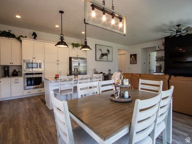 4821 W Juniper Bend Cir Unit 101, Herriman, UT 84096 - dining room with dark wood-style flooring, recessed lighting, and ceiling fan