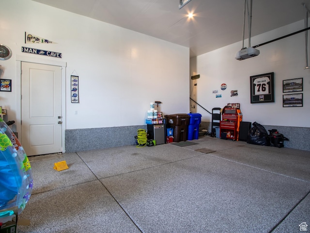 4821 W Juniper Bend Cir Unit 101, Herriman, UT 84096 - garage featuring a garage door opener