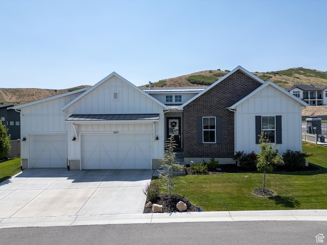 4821 W Juniper Bend Cir Unit 101, Herriman, UT 84096 - modern farmhouse with board and batten siding, an attached garage, driveway, and a front yard