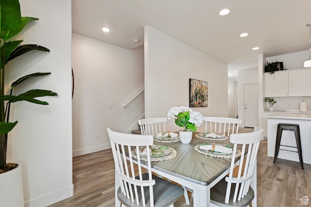 1695 W 2770 S Unit 203, Syracuse, UT 84075 - dining room with light wood finished floors, recessed lighting, and stairway