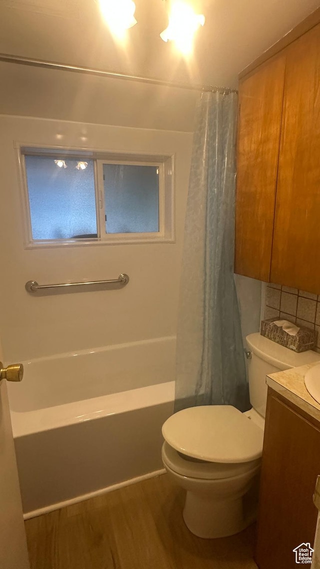 472 N 500 W, Logan, UT 84321 - full bathroom with vanity, wood finished floors, and shower / bath combo with shower curtain