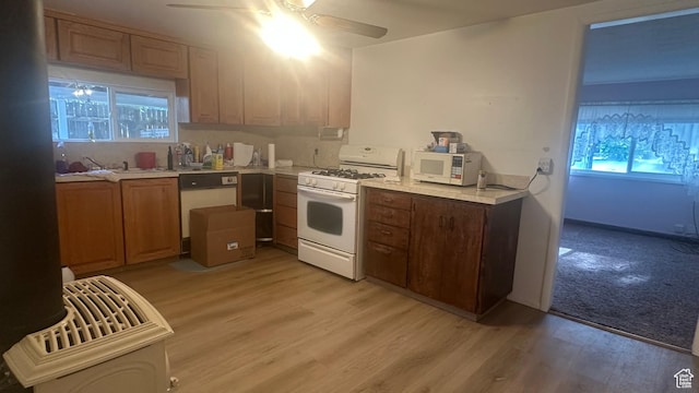 472 N 500 W, Logan, UT 84321 - kitchen with white appliances, a ceiling fan, light countertops, and light wood finished floors