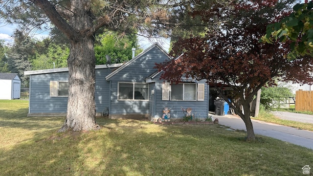 472 N 500 W, Logan, UT 84321 - view of front of home featuring a front yard and a shed