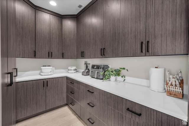 385 E Entrada Dr, Virgin, UT 84779 - kitchen featuring light countertops, dark brown cabinetry, and light wood finished floors