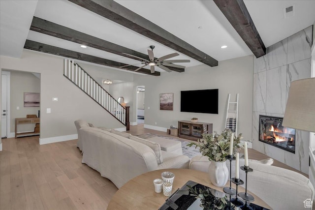 385 E Entrada Dr, Virgin, UT 84779 - living area featuring stairway, a fireplace, light wood-type flooring, ceiling fan, and beam ceiling