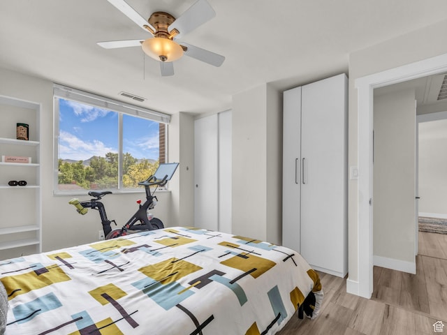 777 E S Temple Unit 5A, Salt Lake City, UT 84102 - bedroom featuring light wood-style flooring and a ceiling fan