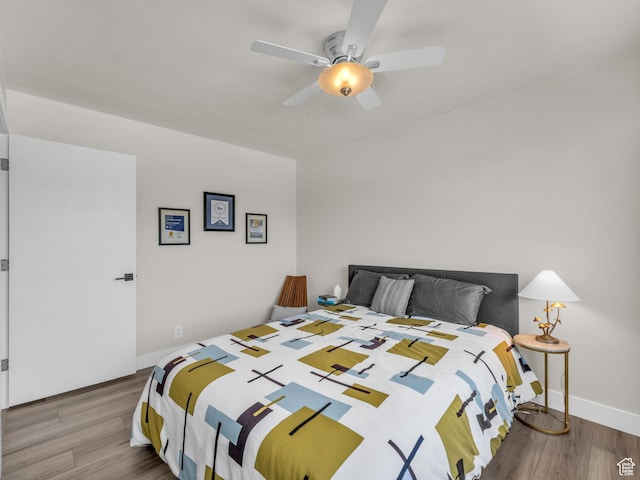 777 E S Temple Unit 5A, Salt Lake City, UT 84102 - bedroom with wood finished floors and a ceiling fan