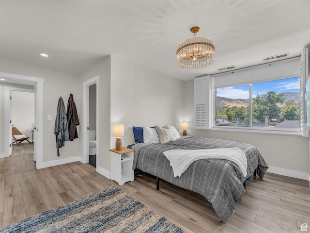 777 E S Temple Unit 5A, Salt Lake City, UT 84102 - bedroom featuring a chandelier, wood finished floors, and recessed lighting