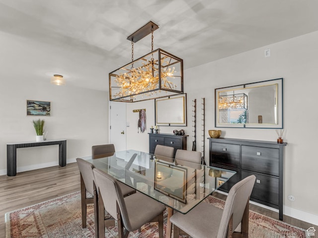 777 E S Temple Unit 5A, Salt Lake City, UT 84102 - dining area featuring wood finished floors and a chandelier