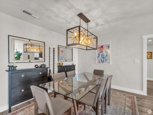 777 E S Temple Unit 5A, Salt Lake City, UT 84102 - dining space featuring wood finished floors and a chandelier