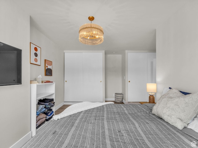 777 E S Temple Unit 5A, Salt Lake City, UT 84102 - bedroom featuring a chandelier and a closet