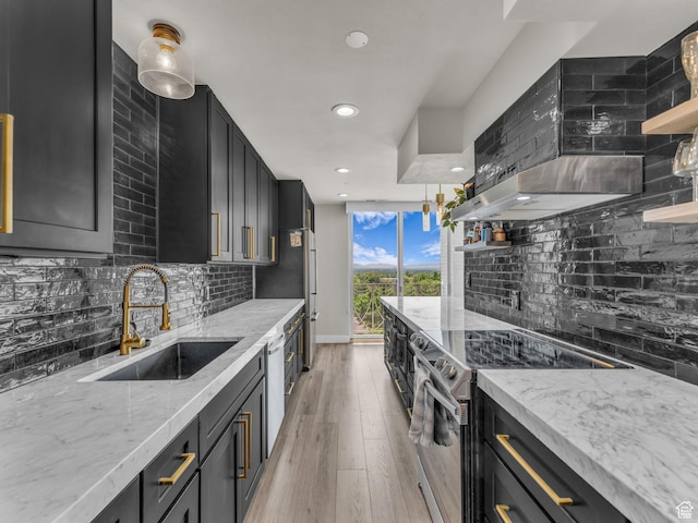 777 E S Temple Unit 5A, Salt Lake City, UT 84102 - kitchen featuring stainless steel electric range, dark cabinets, backsplash, wall chimney range hood, and recessed lighting