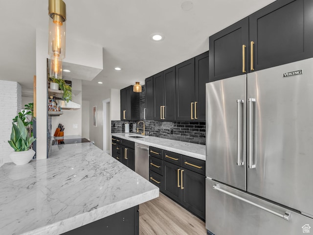 777 E S Temple Unit 5A, Salt Lake City, UT 84102 - kitchen featuring appliances with stainless steel finishes, open shelves, recessed lighting, dark cabinets, and backsplash