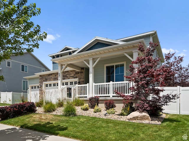 6412 W Chan Reese Dr, West Jordan, UT 84081 - view of front of property featuring a porch, a garage, and stone siding