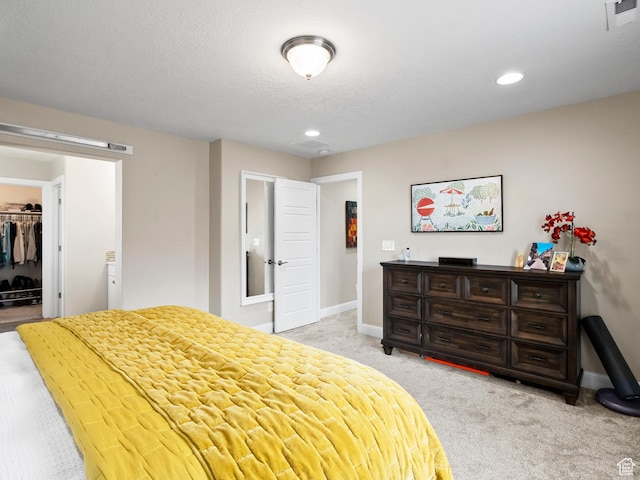 6412 W Chan Reese Dr, West Jordan, UT 84081 - bedroom with light colored carpet, a spacious closet, recessed lighting, and a closet