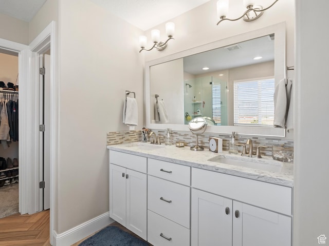 6412 W Chan Reese Dr, West Jordan, UT 84081 - full bath featuring a walk in closet, a shower stall, double vanity, and tasteful backsplash