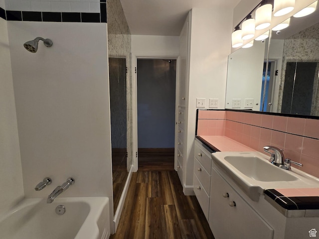 638 E 1050 N, Bountiful, UT 84010 - full bath with wood finished floors, vanity, a tub, backsplash, and a shower
