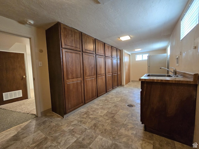638 E 1050 N, Bountiful, UT 84010 - kitchen featuring a textured ceiling, freestanding refrigerator, and stone finish flooring