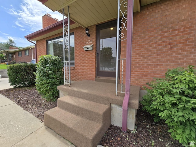 638 E 1050 N, Bountiful, UT 84010 - property entrance featuring brick siding and a chimney