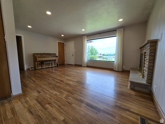 638 E 1050 N, Bountiful, UT 84010 - unfurnished living room with recessed lighting, wood finished floors, and a fireplace with raised hearth