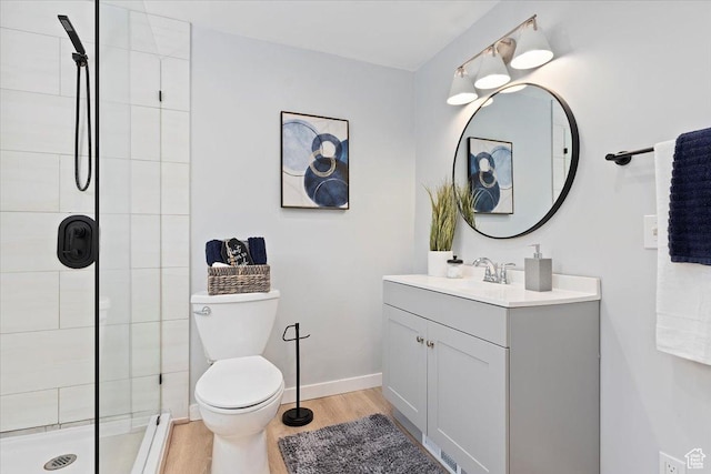 2268 E 7160 S, Cottonwood Heights, UT 84121 - bathroom with vanity, a tile shower, and wood finished floors