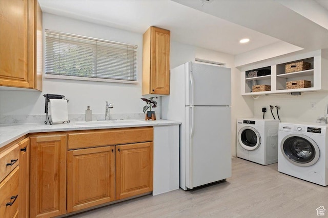 2268 E 7160 S, Cottonwood Heights, UT 84121 - laundry room with light wood finished floors, washing machine and dryer, and recessed lighting