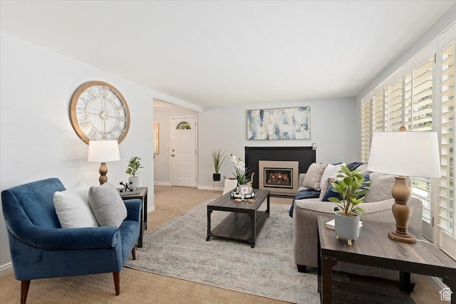 2268 E 7160 S, Cottonwood Heights, UT 84121 - carpeted living room featuring a warm lit fireplace and baseboards