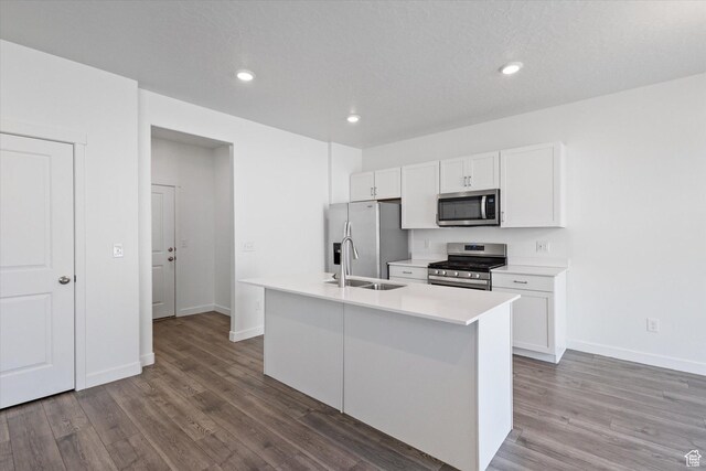 312 N 440 W, Pleasant Grove, UT 84062 - kitchen featuring appliances with stainless steel finishes, white cabinets, wood finished floors, and recessed lighting