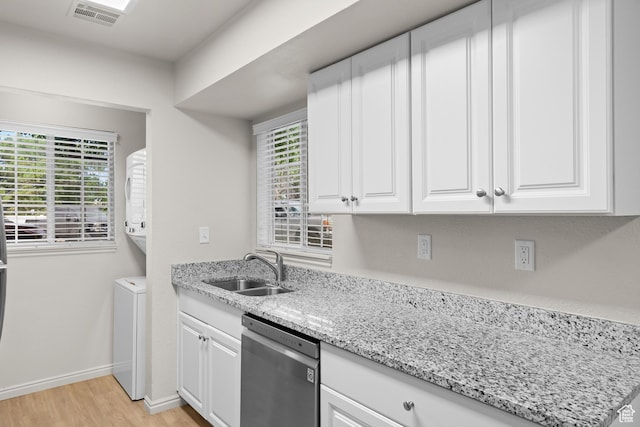 650 S Main St Unit 7105, Bountiful, UT 84010 - kitchen with stainless steel dishwasher, light wood finished floors, white cabinetry, and light stone countertops