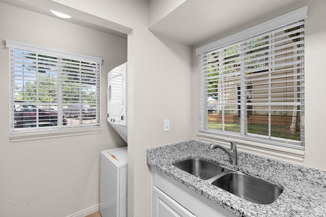 650 S Main St Unit 7105, Bountiful, UT 84010 - washroom with stacked washer and clothes dryer and cabinet space
