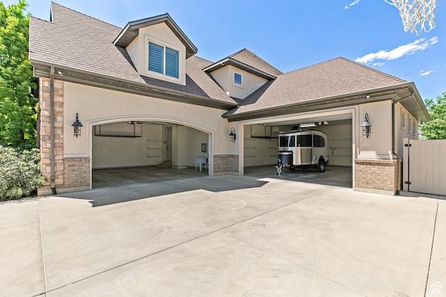 1095 N 700 W, American Fork, UT 84003 - view of front of home with concrete driveway, stucco siding, a garage, and a shingled roof