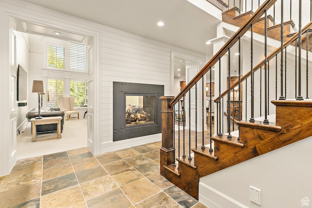 1095 N 700 W, American Fork, UT 84003 - stairs with stone tile flooring, recessed lighting, a towering ceiling, and a multi sided fireplace