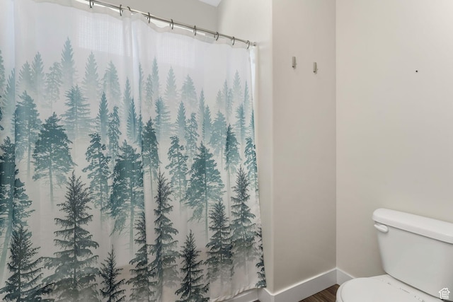 13073 S Newbridge Ln Unit E301, Herriman, UT 84096 - bathroom featuring wood finished floors and a shower with curtain
