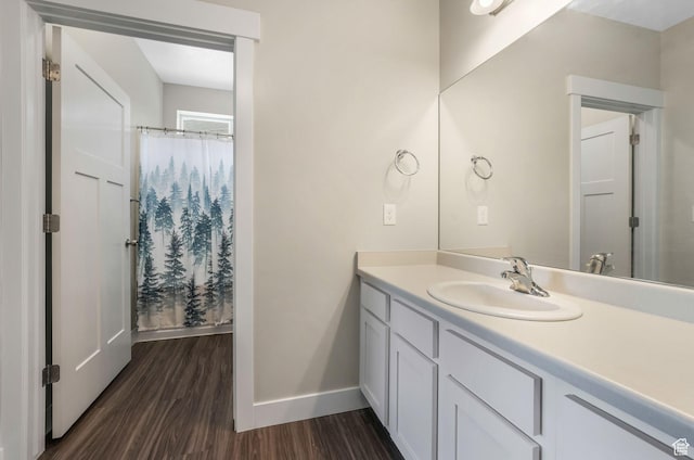 13073 S Newbridge Ln Unit E301, Herriman, UT 84096 - full bath featuring wood finished floors, vanity, and a shower with curtain