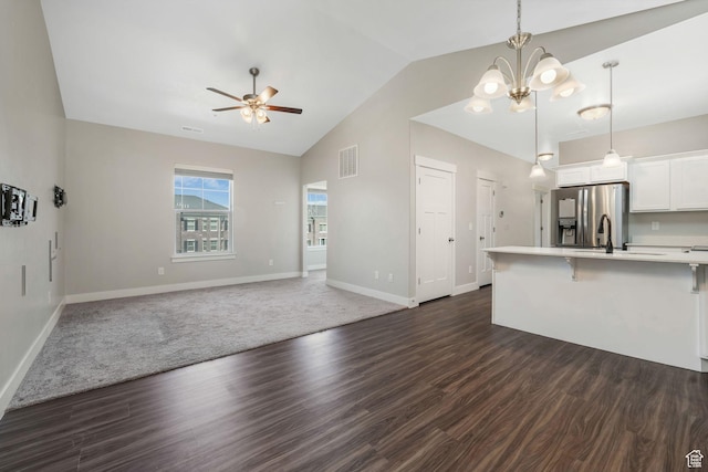 13073 S Newbridge Ln Unit E301, Herriman, UT 84096 - kitchen featuring stainless steel refrigerator with ice dispenser, ceiling fan, light countertops, a breakfast bar area, and open floor plan